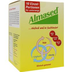 Eine gelbe Almased-Verpackung mit Einzelportionen und den Zutaten Soja, Joghurt und Honig.
